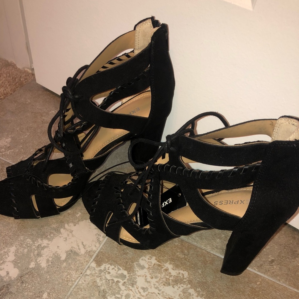Never been worn black, criss cross heels